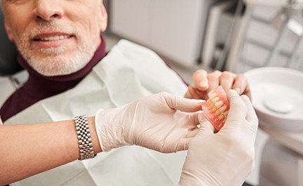 A man getting dentures made