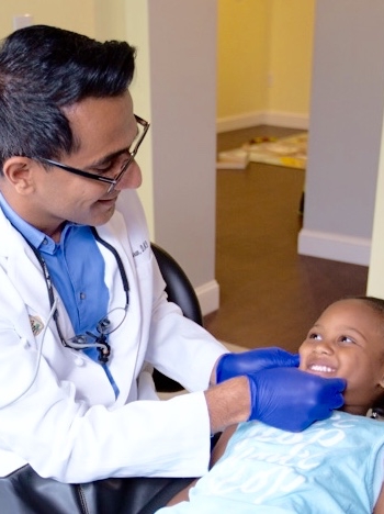 Dentist examining young dental patient