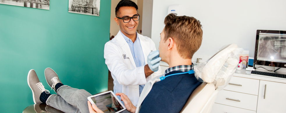 Dr. Saran and patient looking at tablet computer