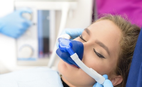 Woman receiving nitrous oxide sedation dentistry treatment
