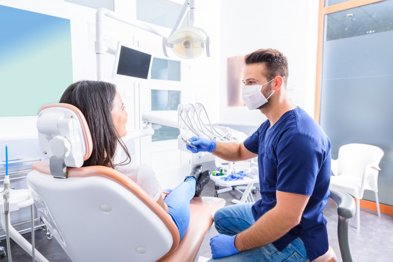 A dentist in Long Island City treating a patient
