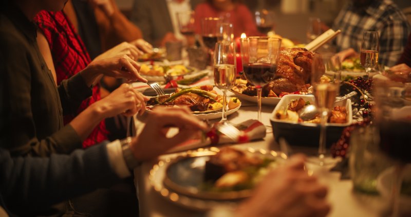 A family gathering for a Thanksgiving feast after their mom's dental implants treatment